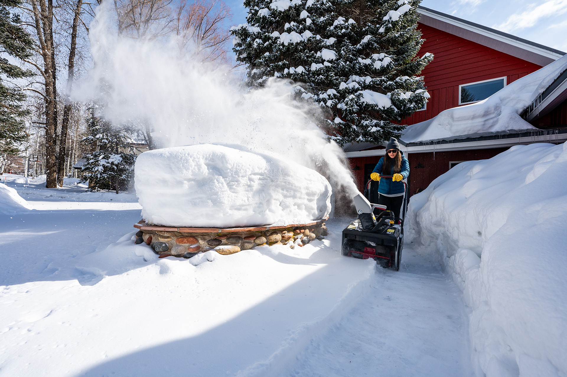 woman snow blowing