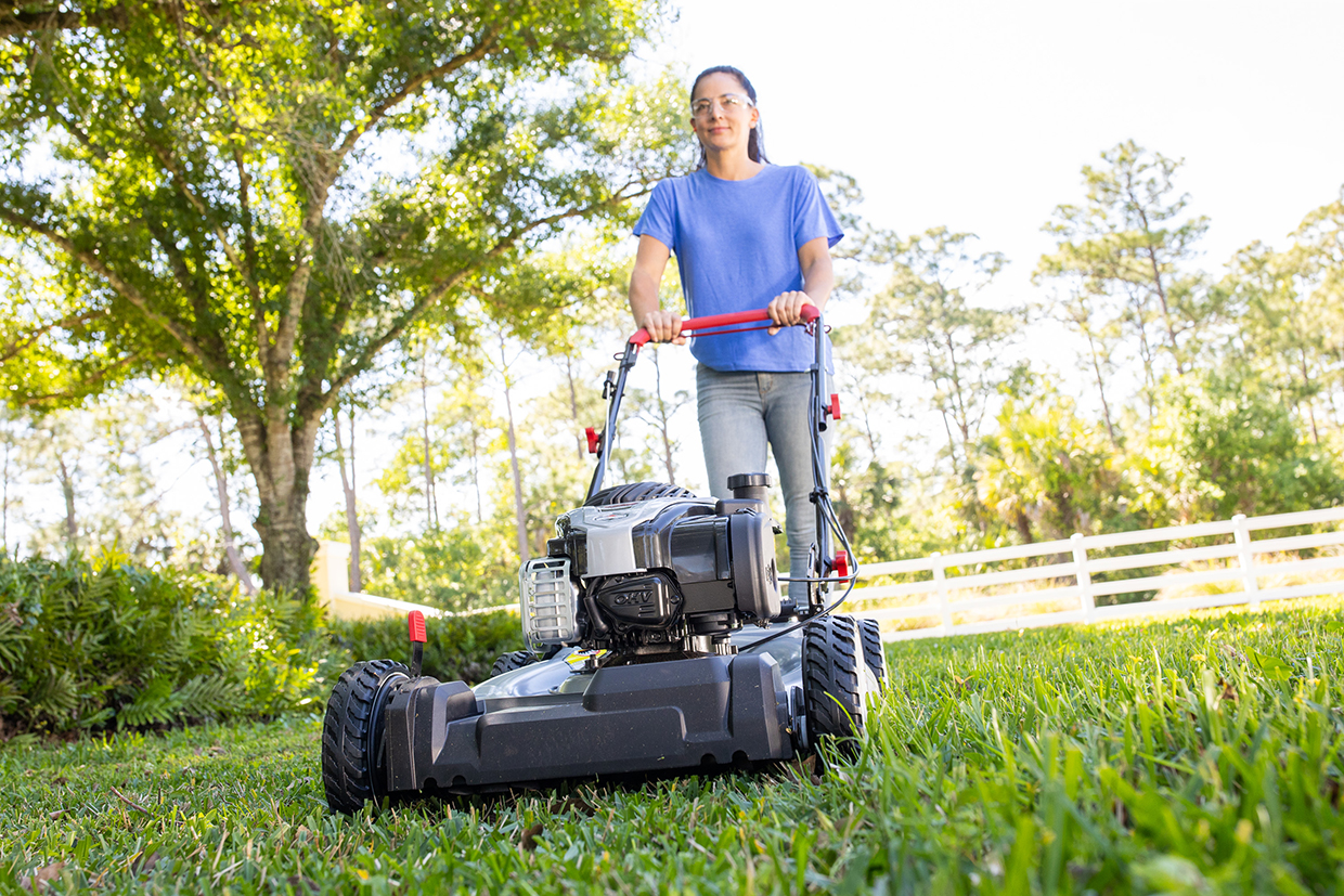 Woman mowing the lawn with Murray self-propelled mower