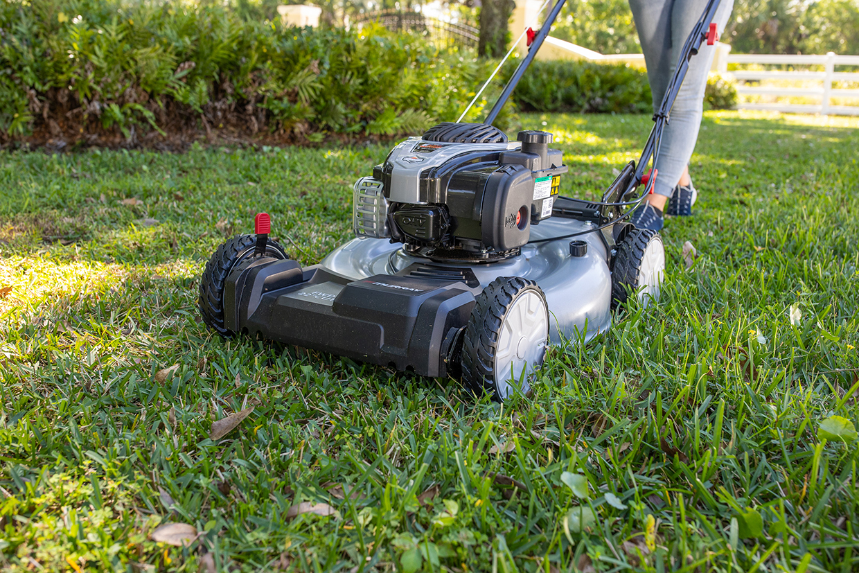 Close-up of Murray self-propelled mower cutting the lawn